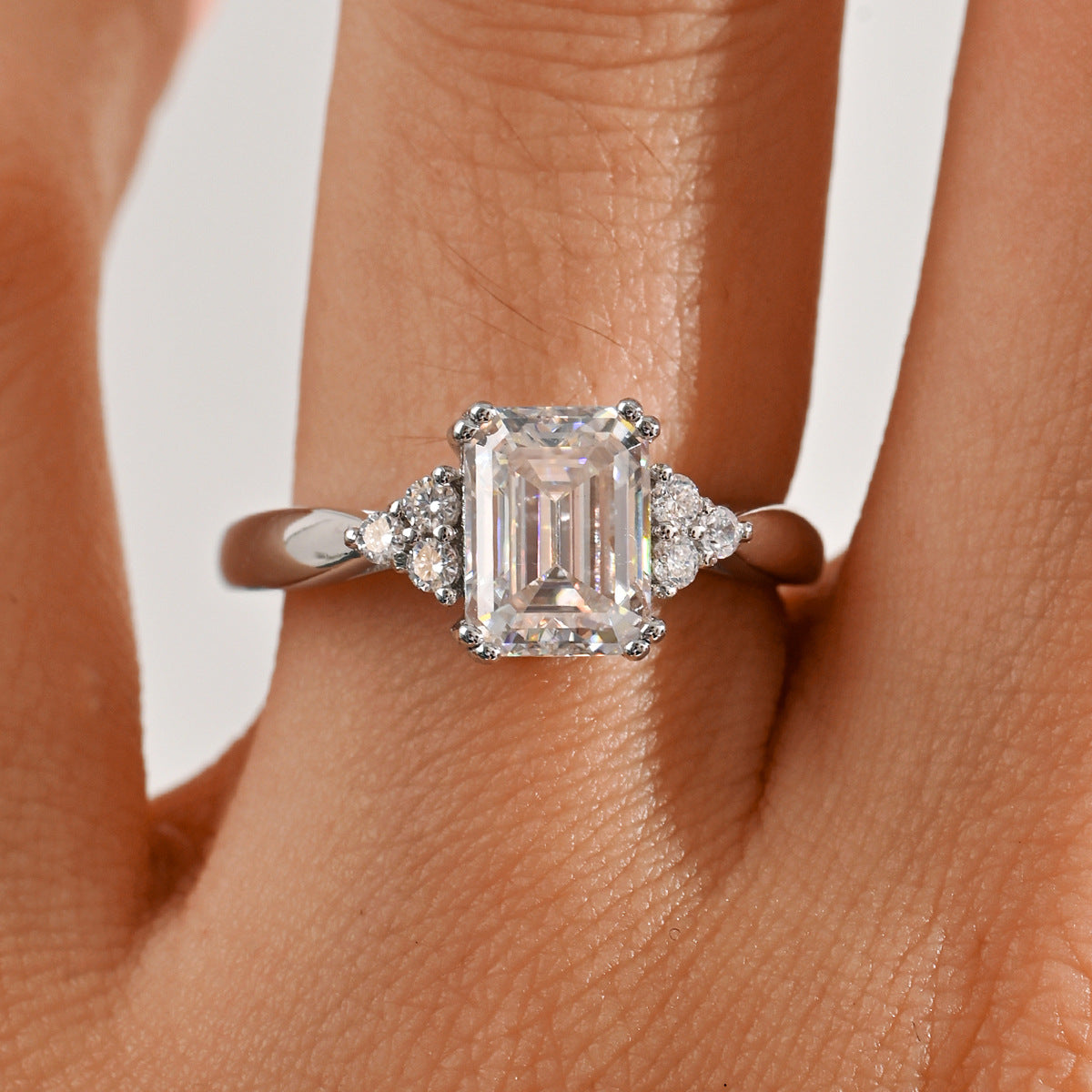 Emerald‑Cut Moissanite with Cluster Side Stones Engagement Ring