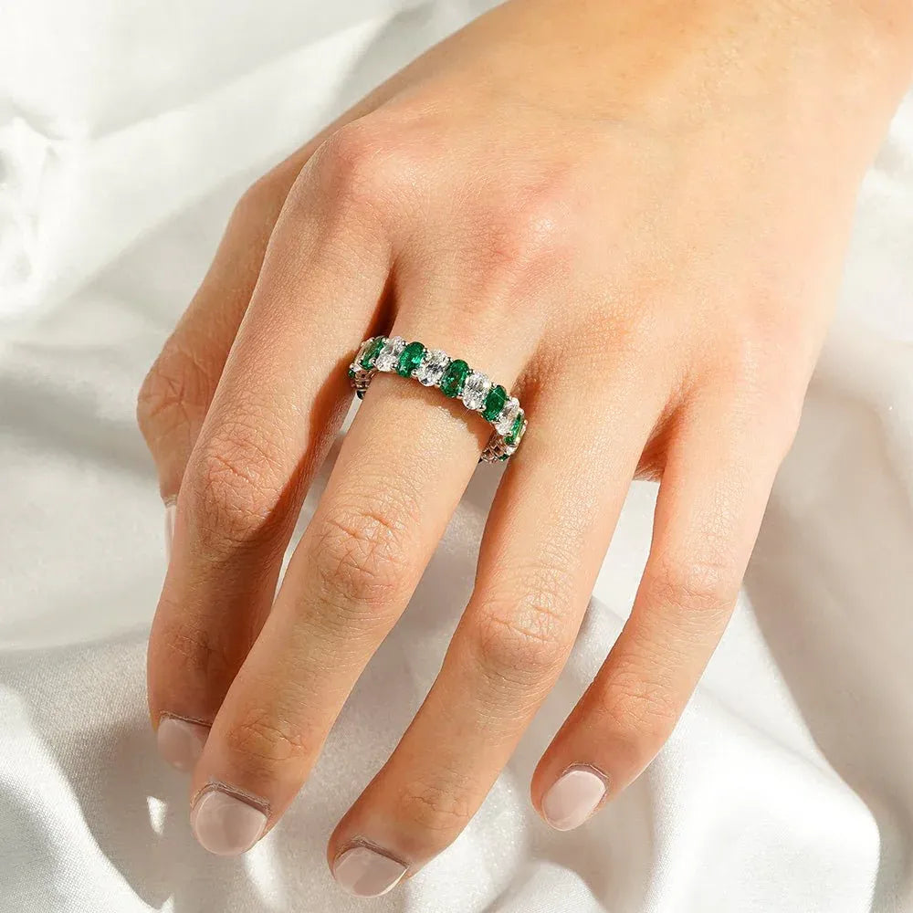 Green and White Oval Moissanite Eternity Band